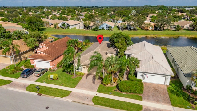 birds eye view of property with a water view