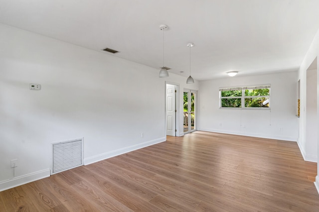 spare room with light hardwood / wood-style flooring