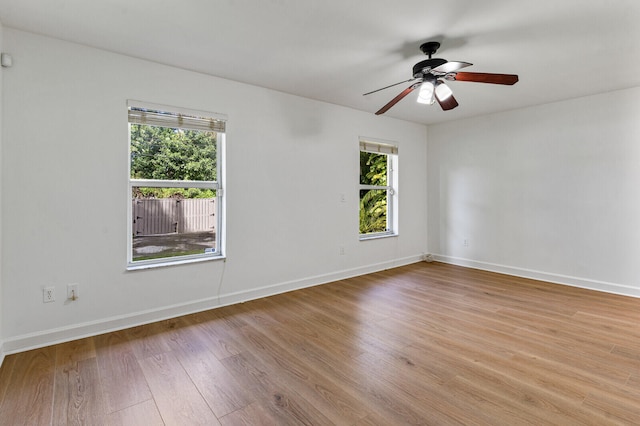 unfurnished room with ceiling fan and light hardwood / wood-style floors