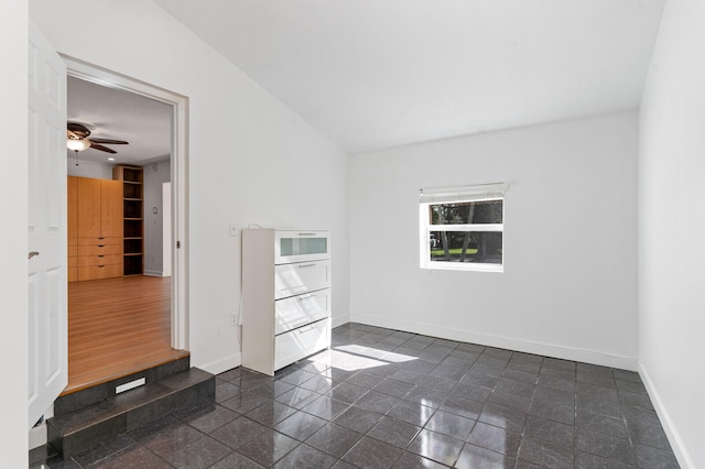 empty room featuring ceiling fan and dark hardwood / wood-style floors