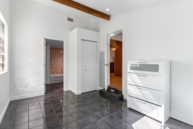 interior space featuring beamed ceiling