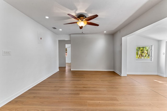 empty room featuring ceiling fan and light hardwood / wood-style flooring