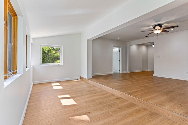 unfurnished room with ceiling fan and light wood-type flooring