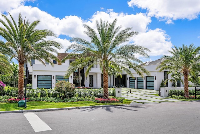 298 W Key Palm Rd, Boca Raton, FL 33432 - view of building exterior featuring a garage and driveway