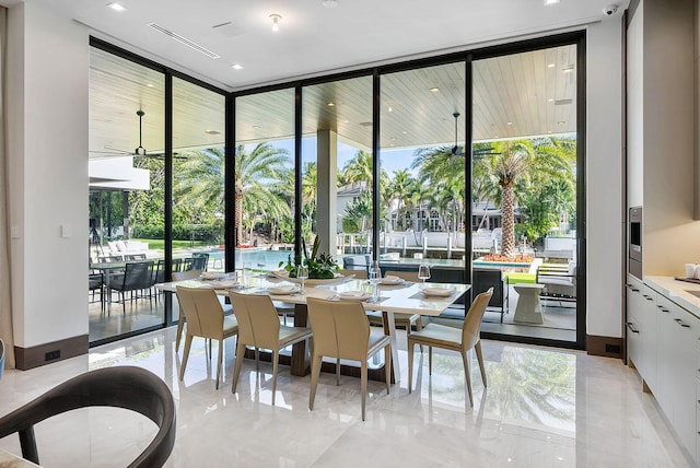 dining space featuring expansive windows