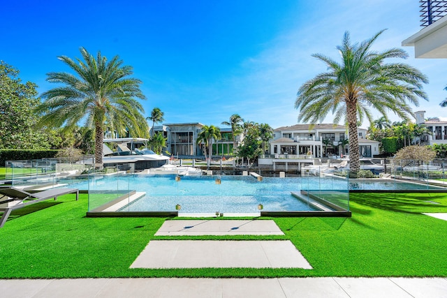 view of pool featuring a yard