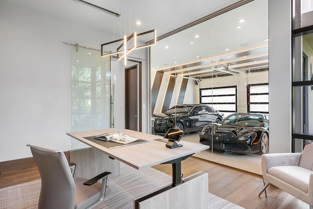 office area with light hardwood / wood-style floors