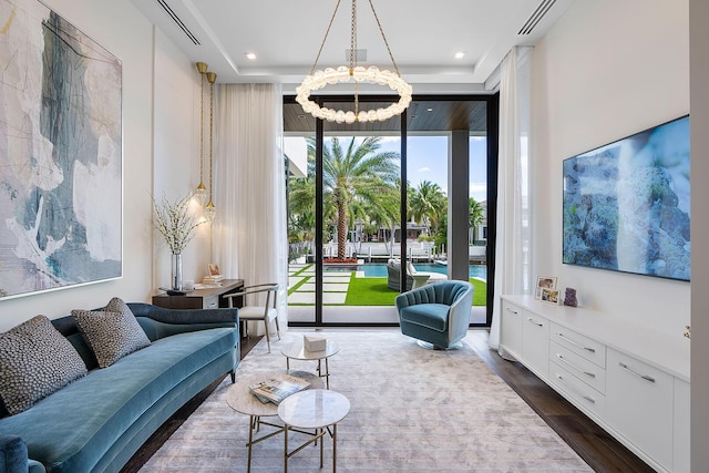 298 W Key Palm Rd, Boca Raton, FL 33432 - living area with dark wood-style floors, a chandelier, a raised ceiling, and recessed lighting