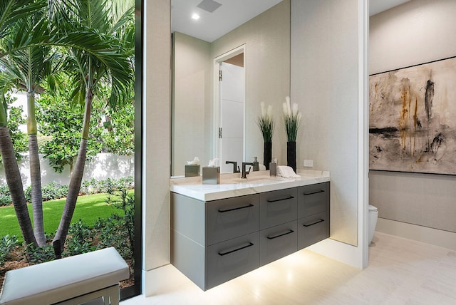 bathroom with vanity and toilet