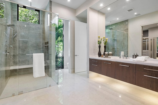 bathroom with tile patterned floors, vanity, an enclosed shower, and toilet