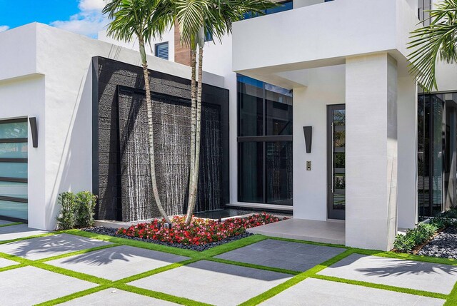 298 W Key Palm Rd, Boca Raton, FL 33432 - property entrance featuring stucco siding