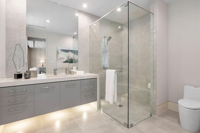 bathroom featuring vanity, an enclosed shower, and toilet