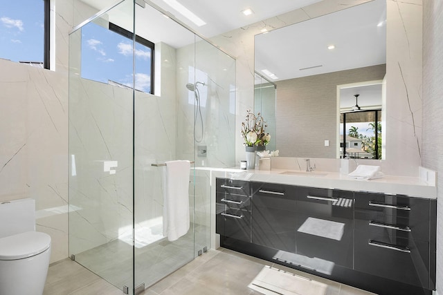 bathroom featuring toilet, vanity, and walk in shower