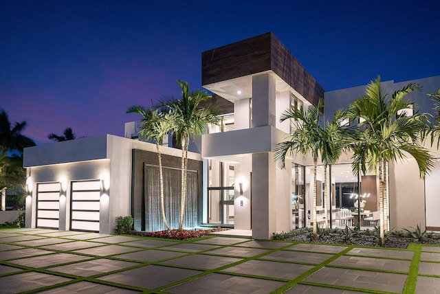 298 W Key Palm Rd, Boca Raton, FL 33432 - modern home with stucco siding and a garage