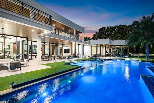 view of swimming pool with a patio area and ceiling fan