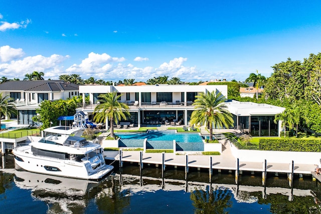 back of property with a water view