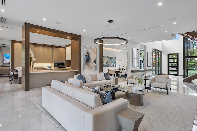 living room featuring an inviting chandelier