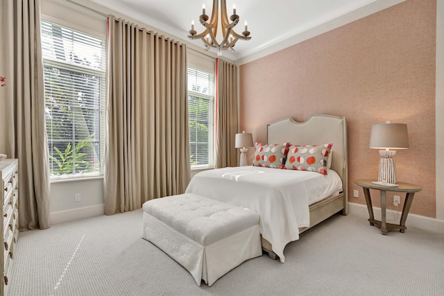 carpeted bedroom with an inviting chandelier and ornamental molding