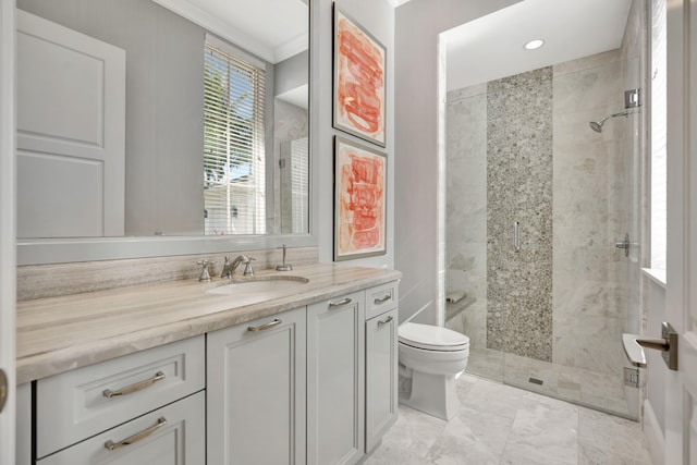 bathroom featuring a shower with door, vanity, ornamental molding, and toilet