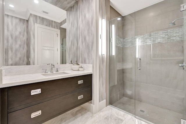 bathroom with vanity, walk in shower, and crown molding