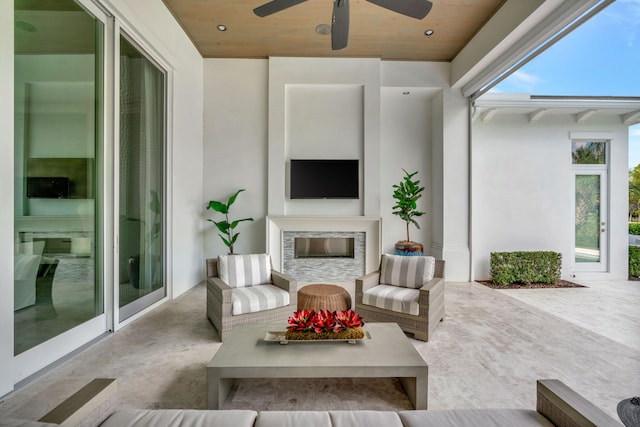 view of patio / terrace featuring ceiling fan and an outdoor living space