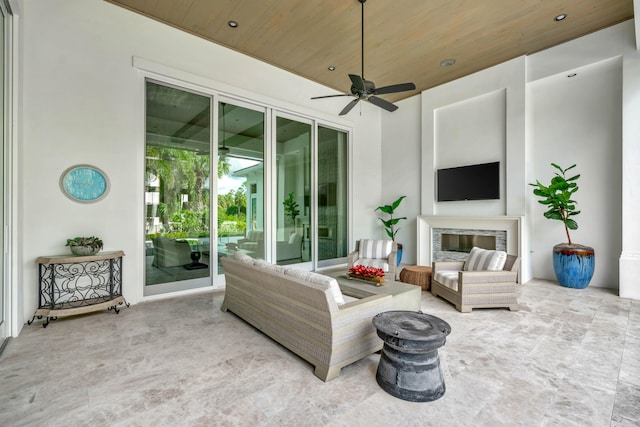 living room featuring a fireplace, ceiling fan, and wood ceiling