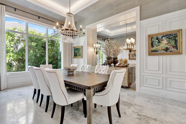 dining room featuring a tray ceiling and a notable chandelier