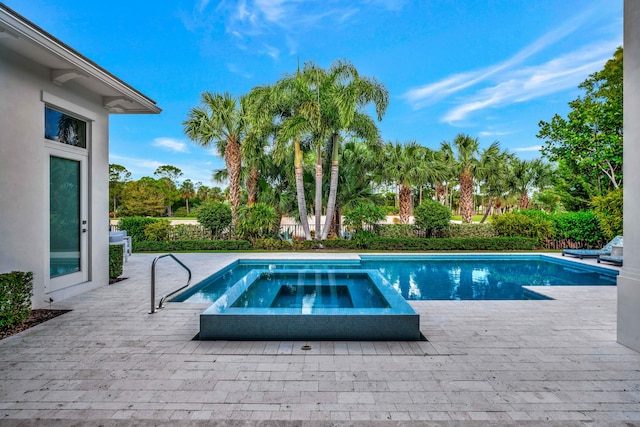 view of pool featuring an in ground hot tub and a patio area