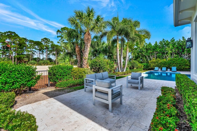 view of patio / terrace featuring outdoor lounge area and a fenced in pool