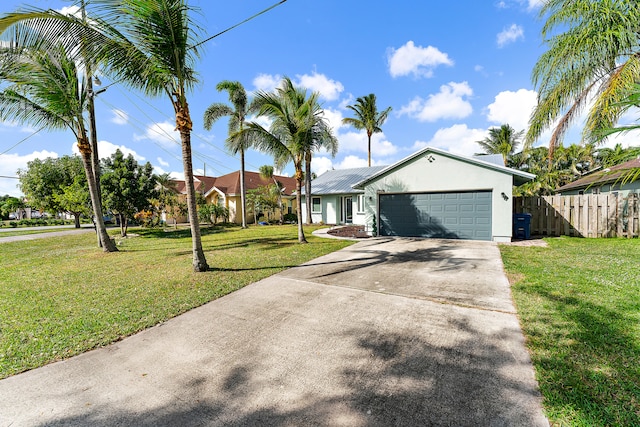 single story home featuring a front yard and a garage