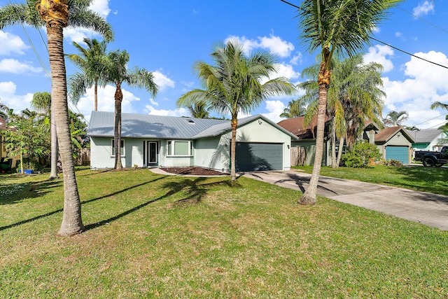 view of front of home featuring a front yard and a garage