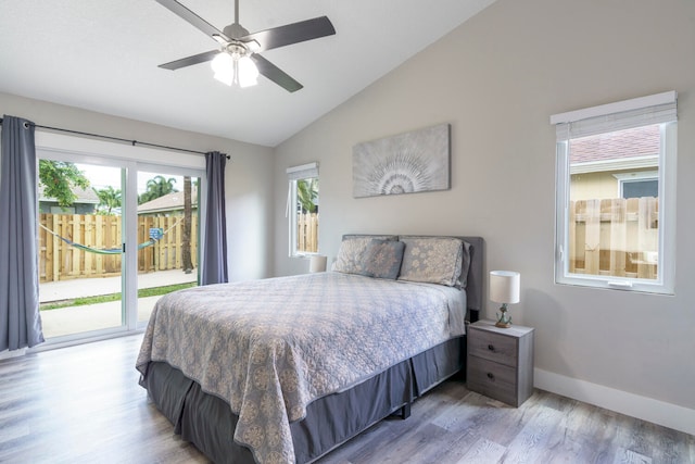 bedroom featuring ceiling fan, lofted ceiling, access to outside, and light hardwood / wood-style flooring