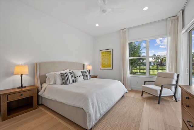 bedroom featuring ceiling fan and light hardwood / wood-style flooring