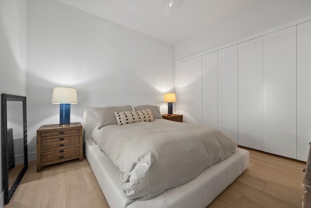 bedroom featuring a closet and light hardwood / wood-style flooring