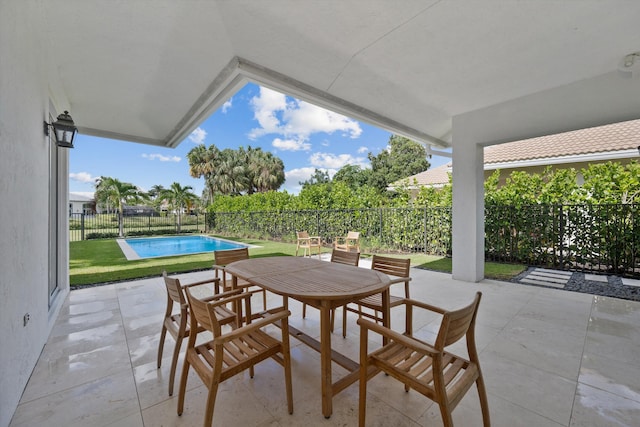 view of patio / terrace featuring a fenced in pool