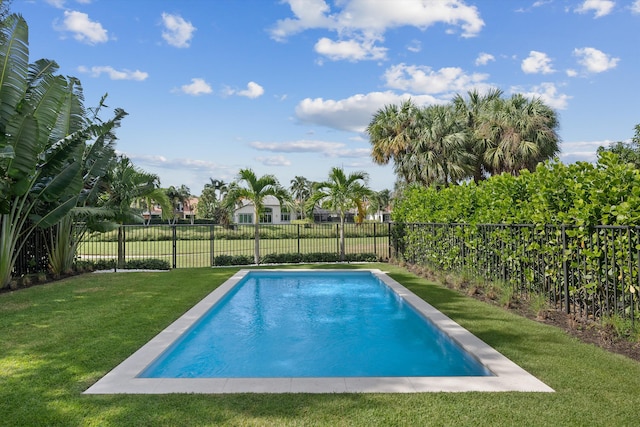 view of pool featuring a lawn