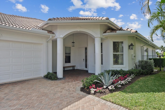 doorway to property featuring a garage