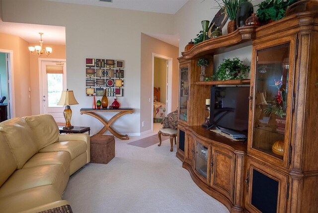 living room with ceiling fan and light colored carpet