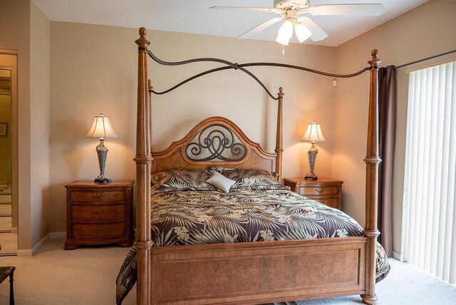 carpeted bedroom featuring ceiling fan