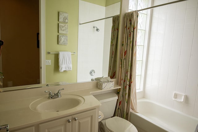 full bathroom with toilet, vanity, and shower / tub combo with curtain