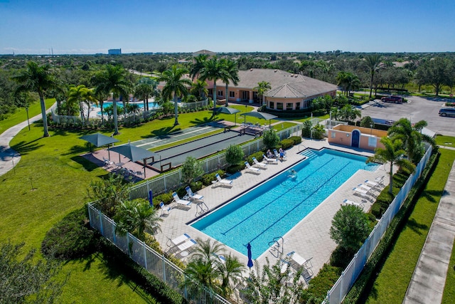 view of pool with a yard and a patio