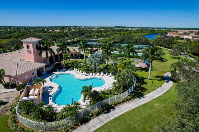 view of pool featuring a lawn