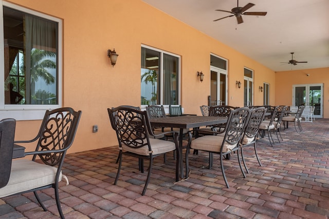 view of patio featuring a ceiling fan and outdoor dining space