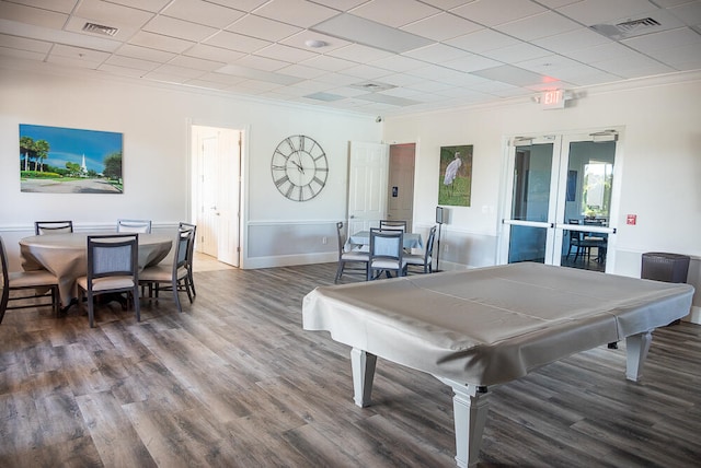 rec room with billiards, a drop ceiling, french doors, and hardwood / wood-style flooring