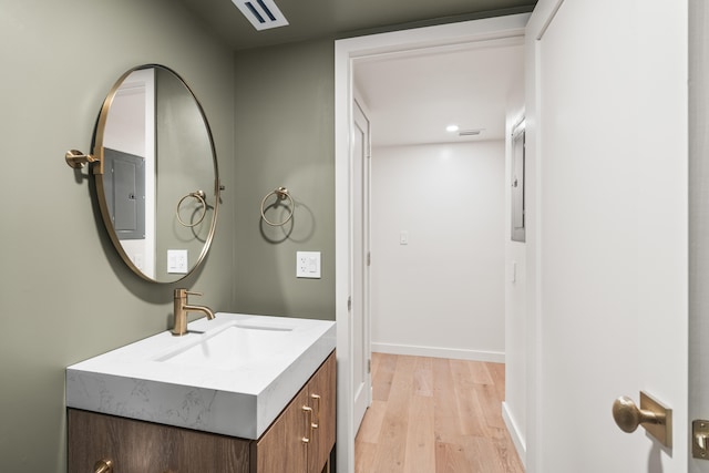 bathroom with vanity and wood-type flooring