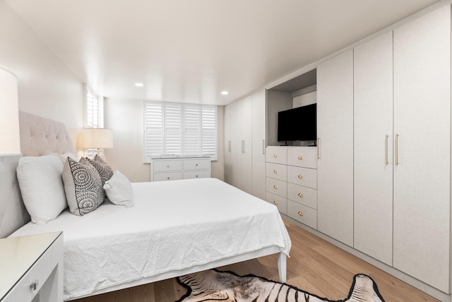 bedroom with light wood-type flooring