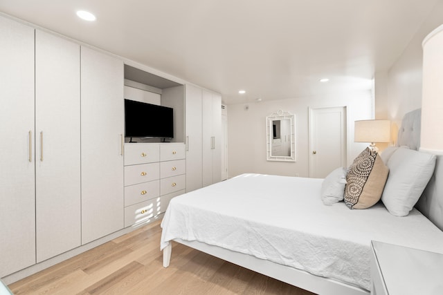 bedroom with light hardwood / wood-style flooring