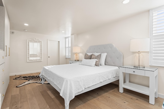 bedroom with light hardwood / wood-style floors