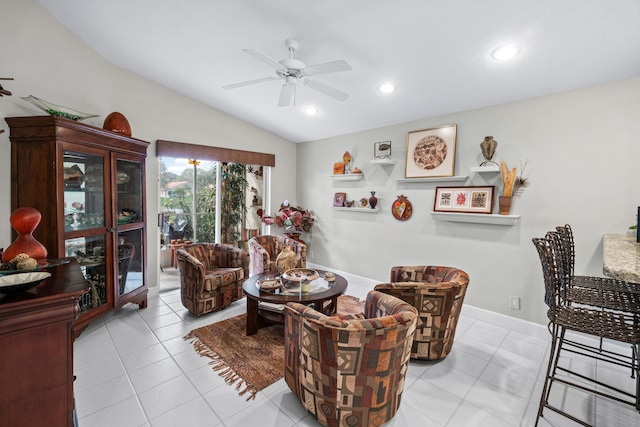 sitting room featuring light tile patterned floors, vaulted ceiling, and ceiling fan