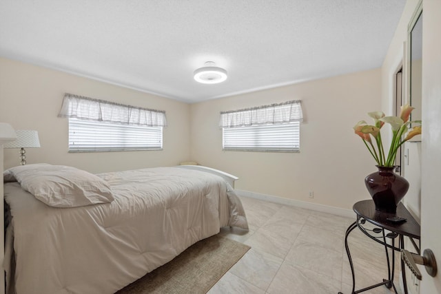 bedroom featuring a textured ceiling